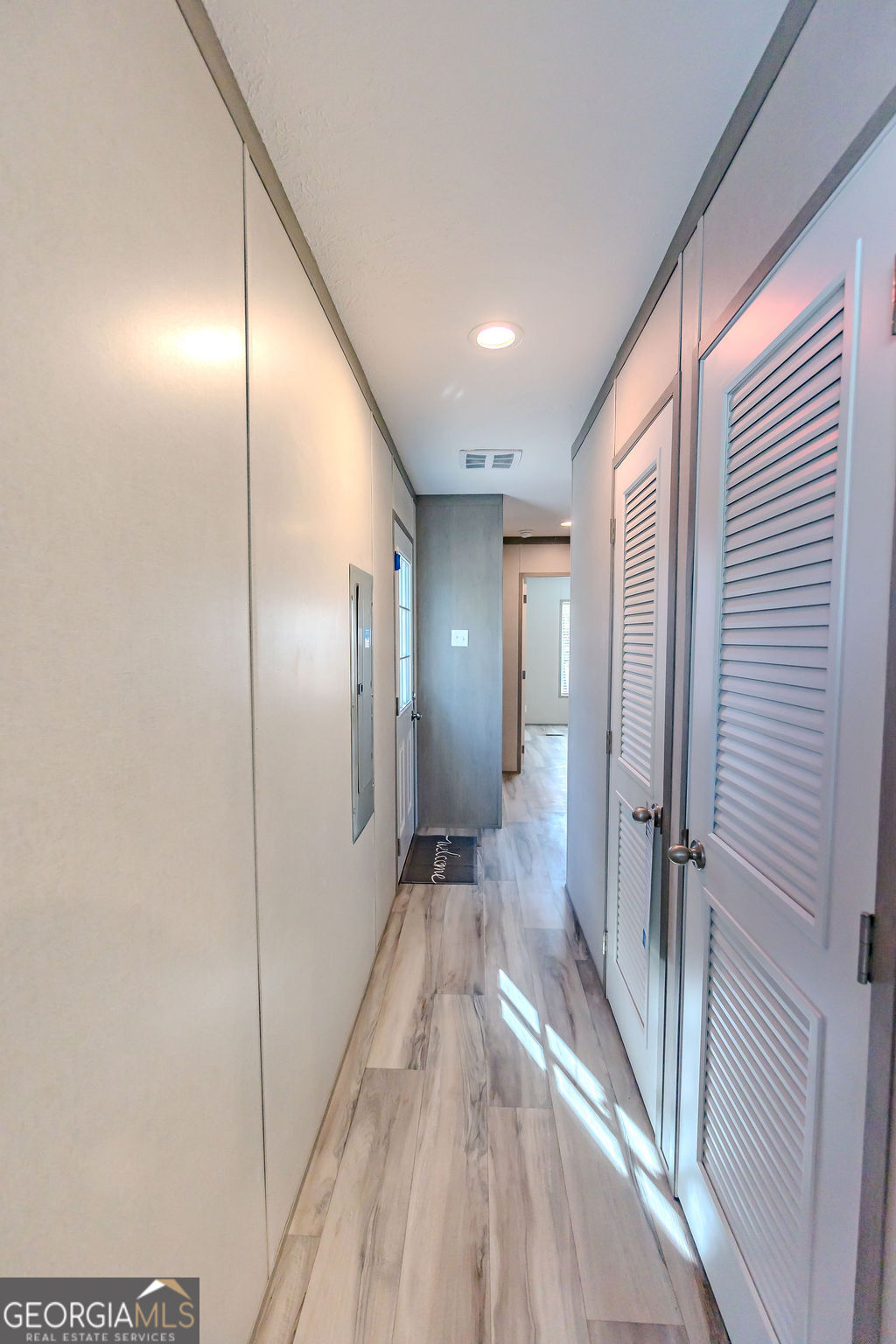 226 Mullis Street Dexter, GA 31019 - Photo 22 of 37 a view of a hallway with wooden floor