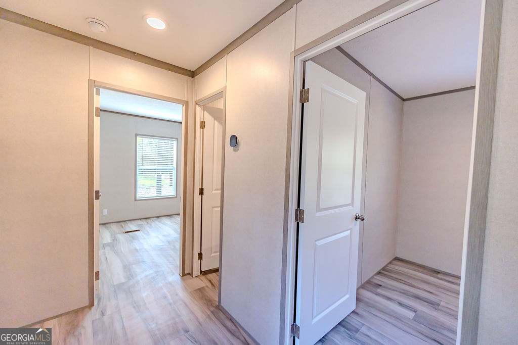 226 Mullis Street Dexter, GA 31019 - Photo 27 of 37 a view of a hallway with wooden floor