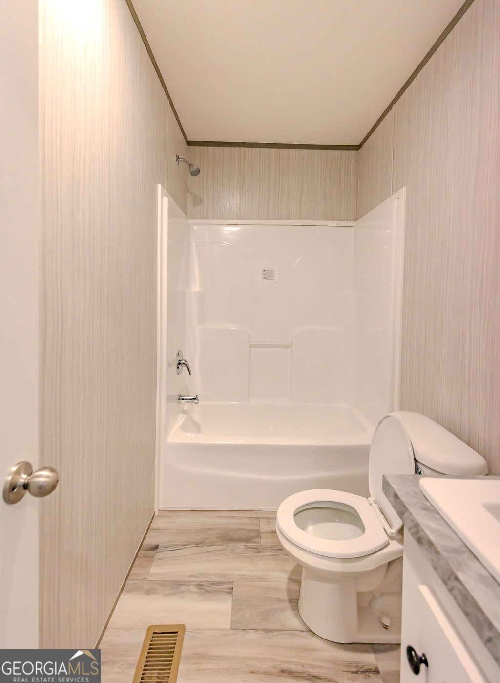 226 Mullis Street Dexter, GA 31019 - Photo 29 of 37 a bathroom with a toilet a sink and a bathtub