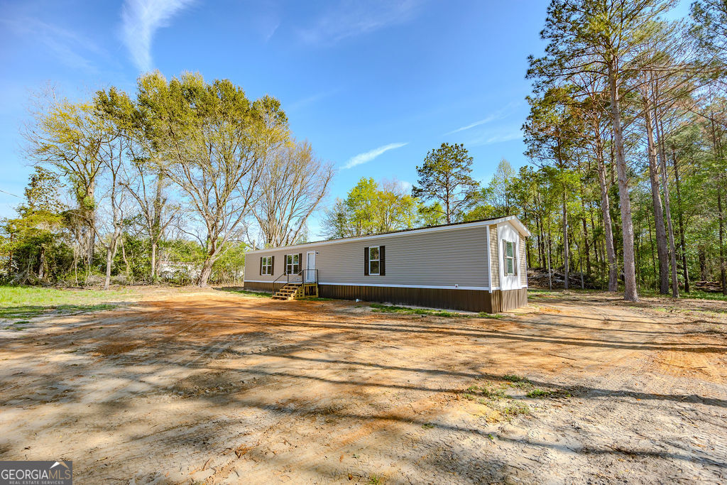 226 Mullis Street Dexter, GA 31019 - Photo 37 of 37 a view of a yard with large trees
