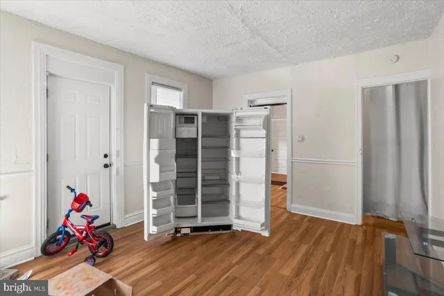 a view of a livingroom with furniture and a window