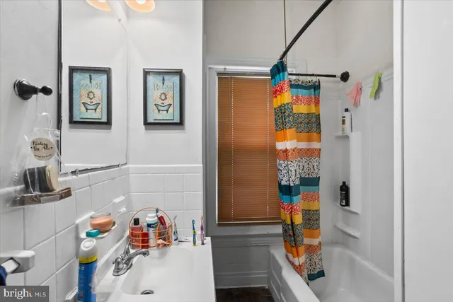 a bathroom with a sink and a shower