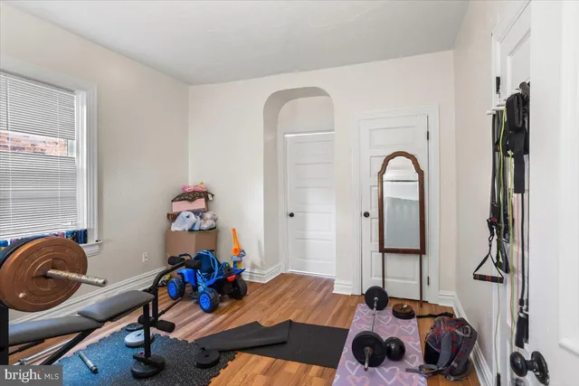 a bedroom with bed and a chandelier