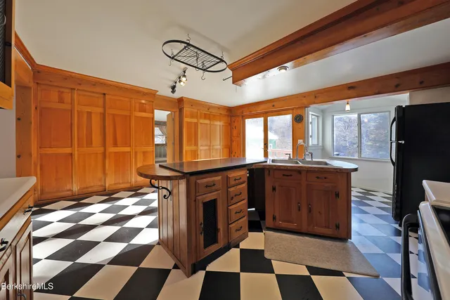 a view of an entryway with wooden floor and staircase