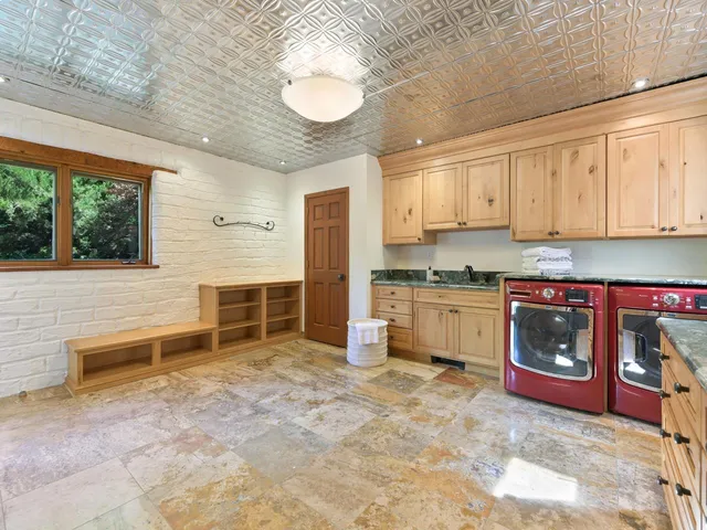a kitchen with a stove a sink and a refrigerator