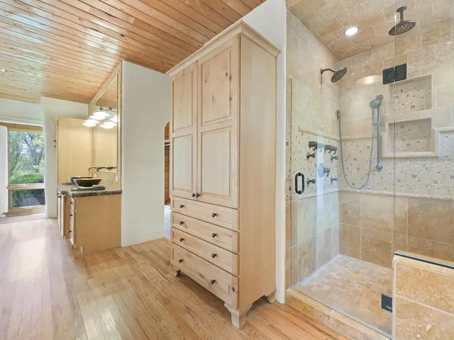 a view of a hallway with wooden floor