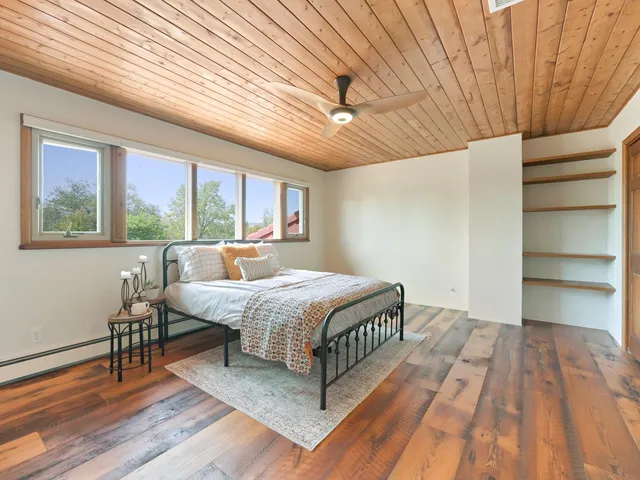 a bed room with a bed and a window