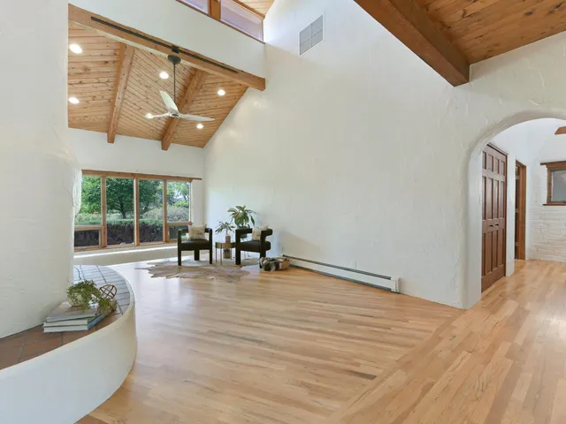 a view of a livingroom with furniture and window