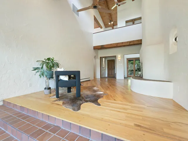 a view of a lobby with chair and table