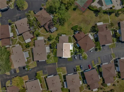 an aerial view of residential houses with outdoor space