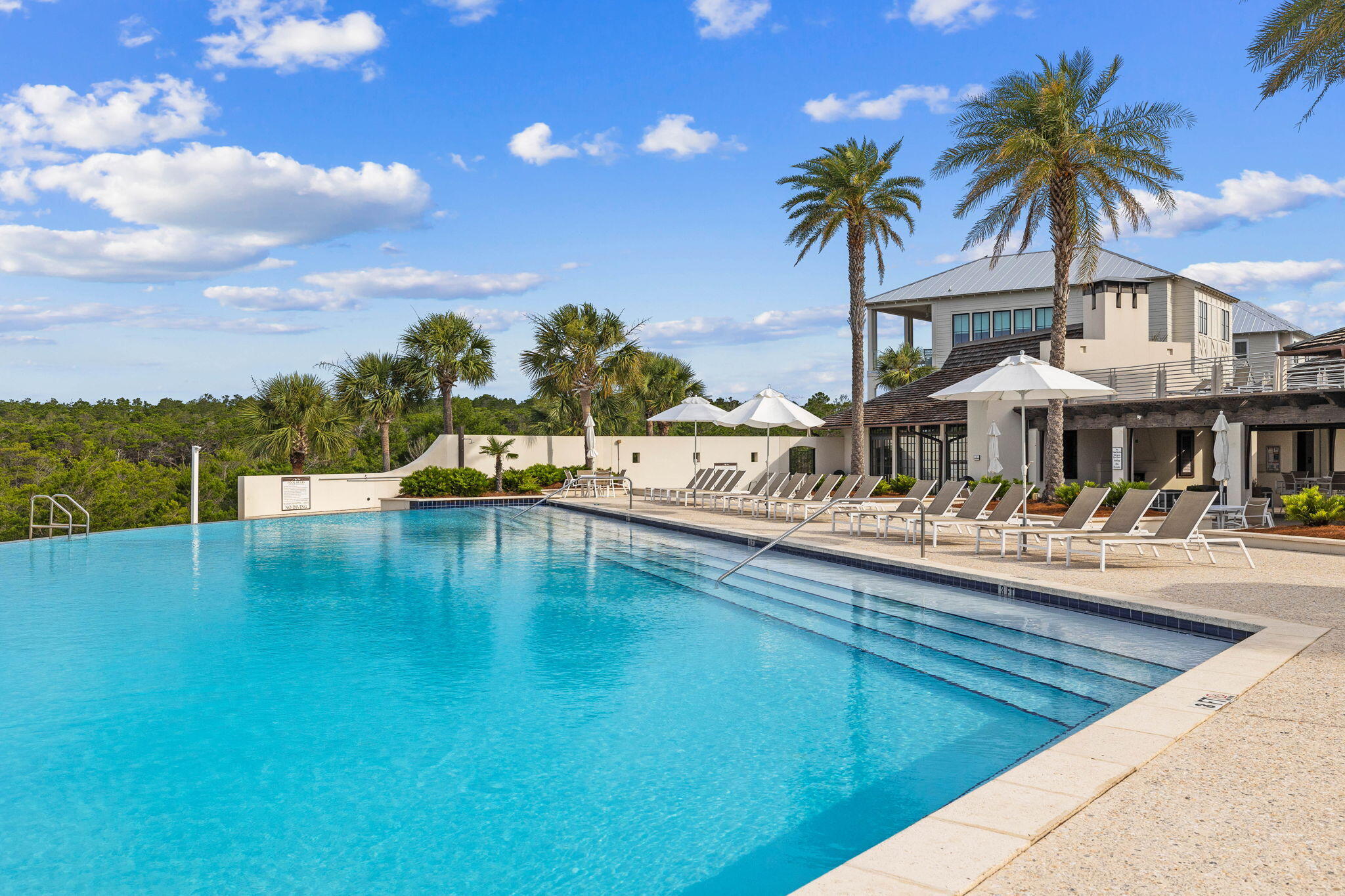 56 Cypress Walk Santa Rosa Beach, FL 32459 - Photo 6 of 8 a view of a swimming pool with a table and chairs