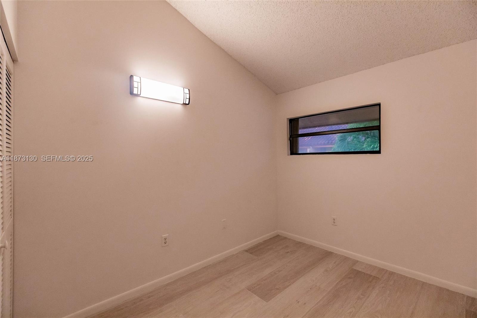 7820 Southwest 102nd Lane Miami, FL 33156 - Photo 15 of 31 an empty room with a painting