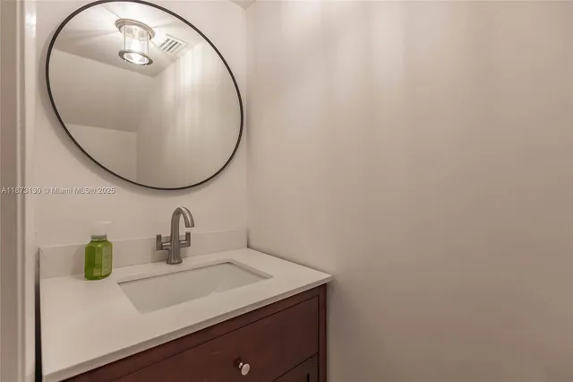 a view of a backyard with wooden fence