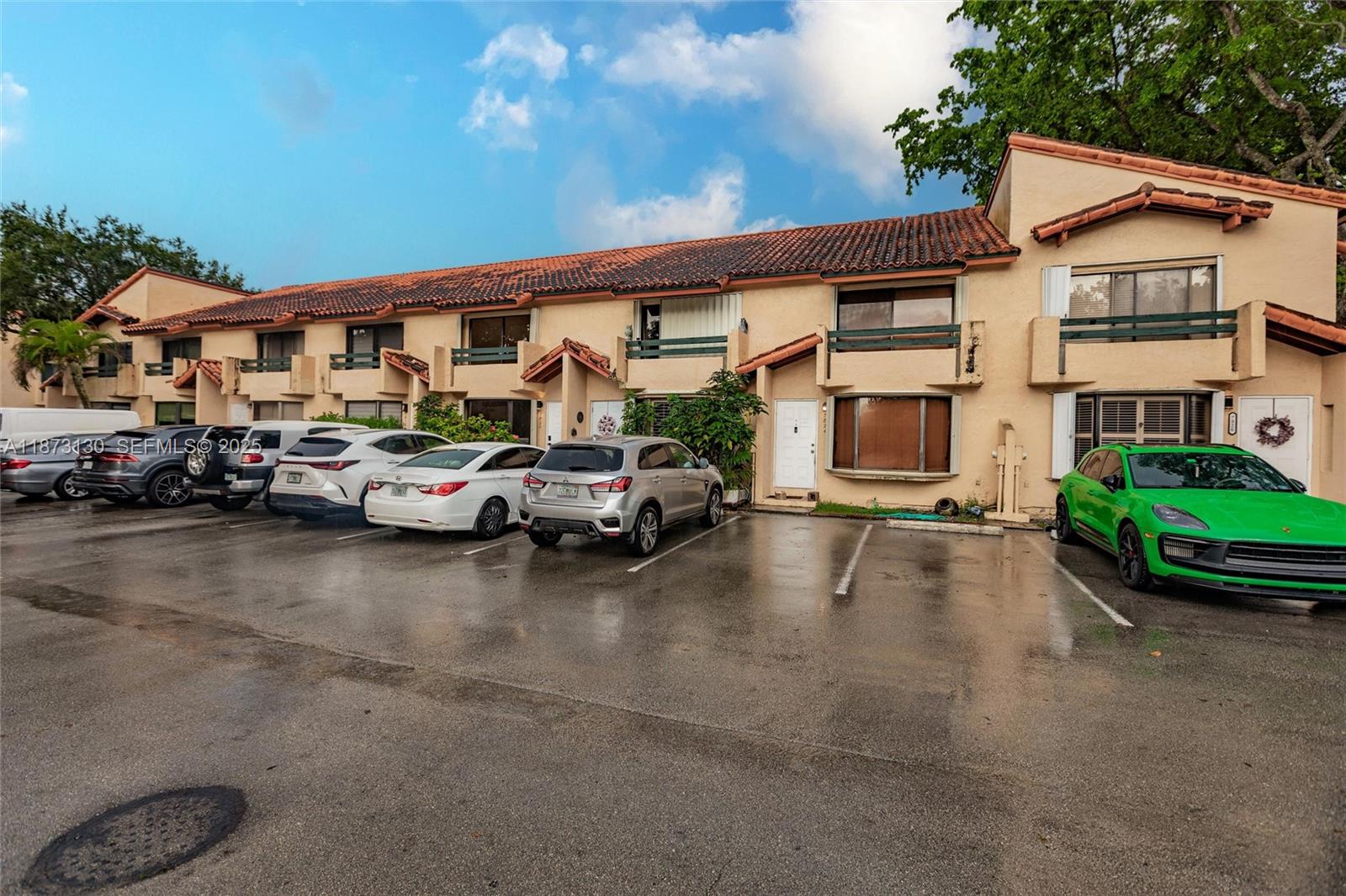 7820 Southwest 102nd Lane Miami, FL 33156 - Photo 26 of 31 a view of a cars park in front of a building
