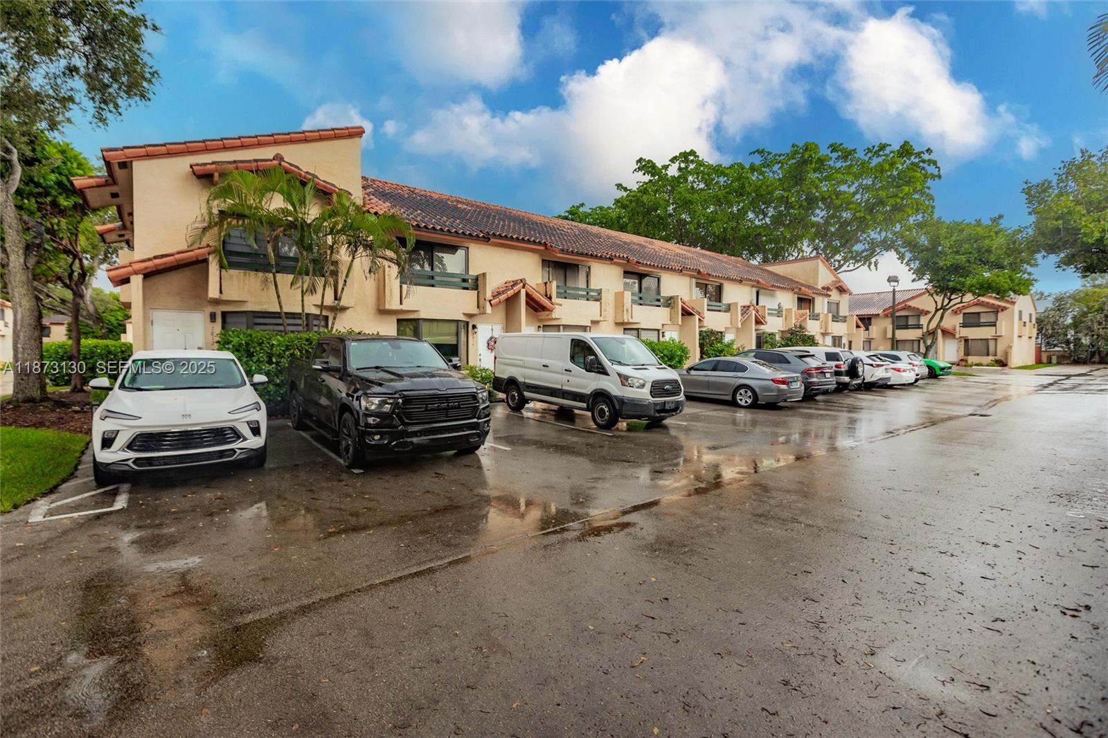 7820 Southwest 102nd Lane Miami, FL 33156 - Photo 27 of 31 a view of a cars park in front of a house