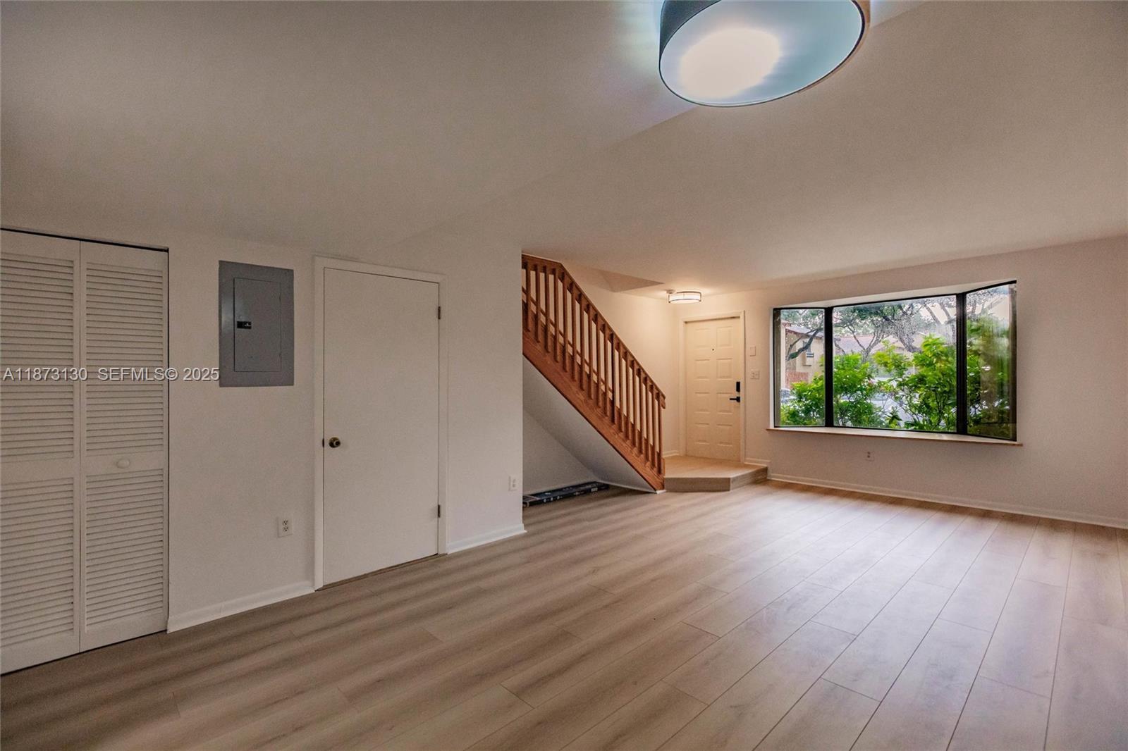 7820 Southwest 102nd Lane Miami, FL 33156 - Photo 10 of 31 a view of a livingroom with wooden floor and window