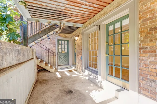 a view of a balcony with door