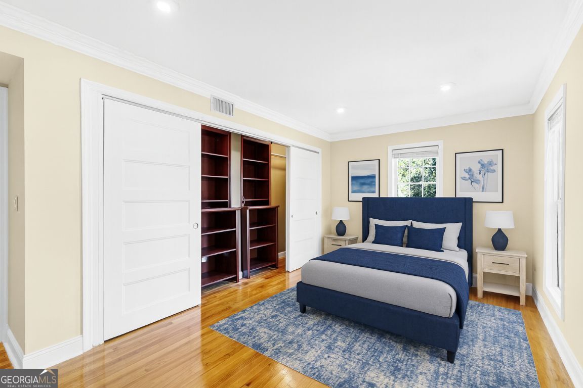 3091 Colonial Way Atlanta, GA 30341 - Photo 13 of 26 a spacious bedroom with a bed and wooden floor