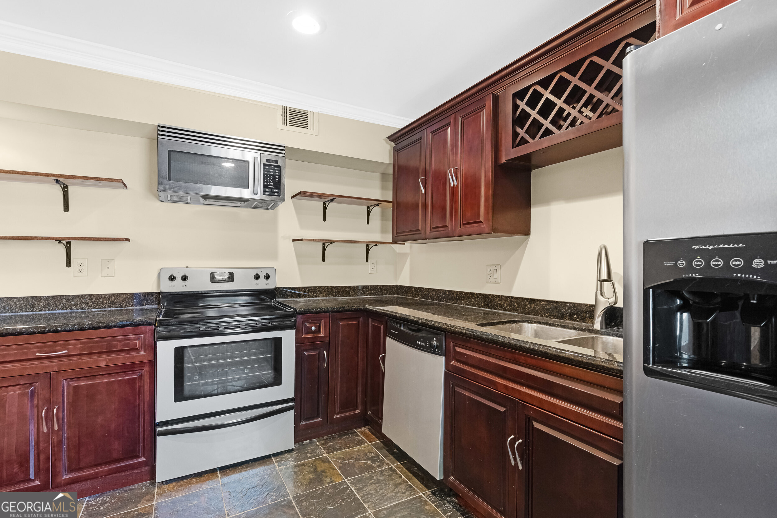 3091 Colonial Way Atlanta, GA 30341 - Photo 5 of 26 a kitchen with stainless steel appliances granite countertop a stove and a sink
