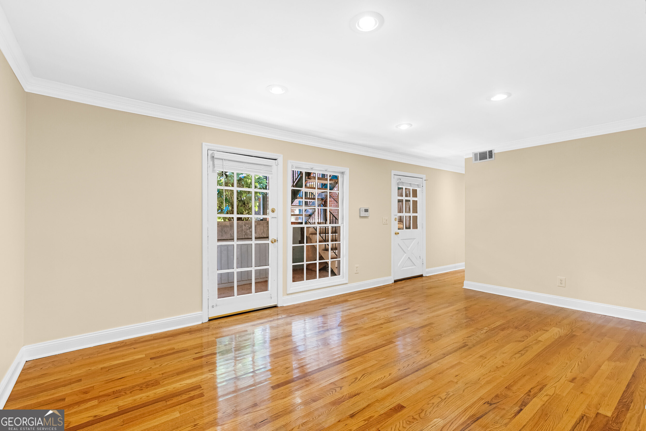 3091 Colonial Way Atlanta, GA 30341 - Photo 9 of 26 a view of an empty room with wooden floor and a window