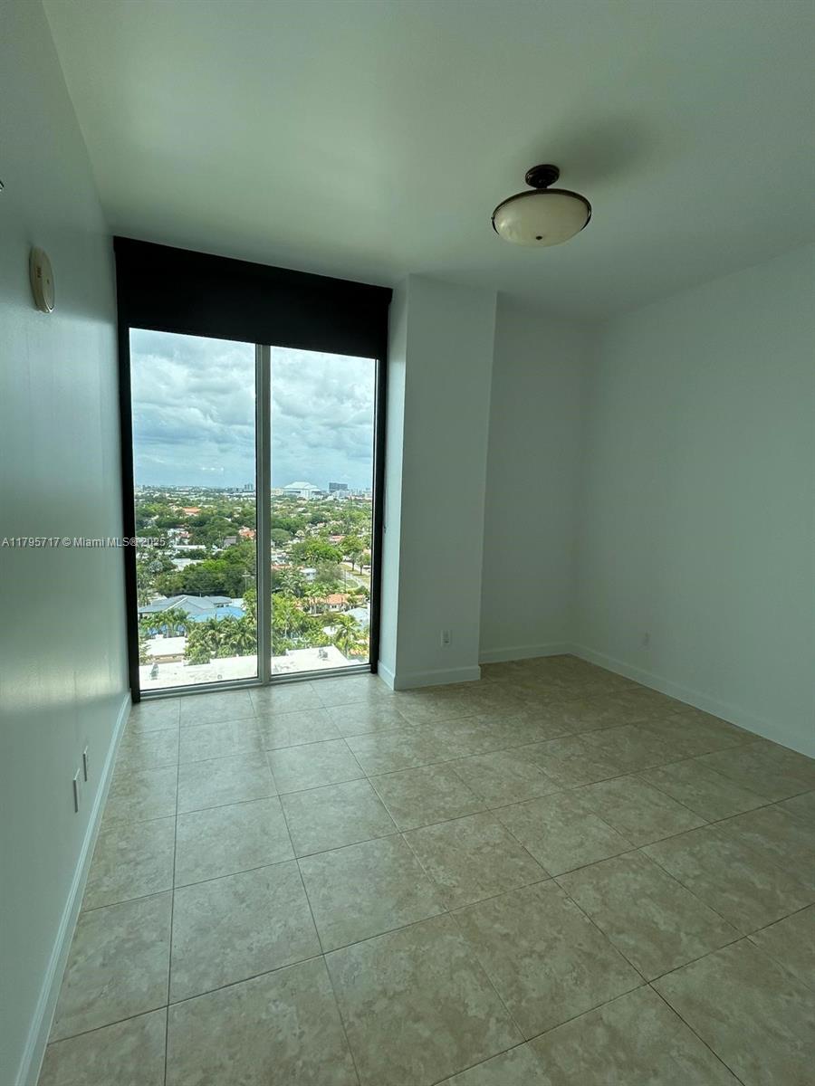 2525 Southwest 3rd Avenue, Unit 1402 Miami, FL 33129 - Photo 20 of 37 a view of an empty room with a window