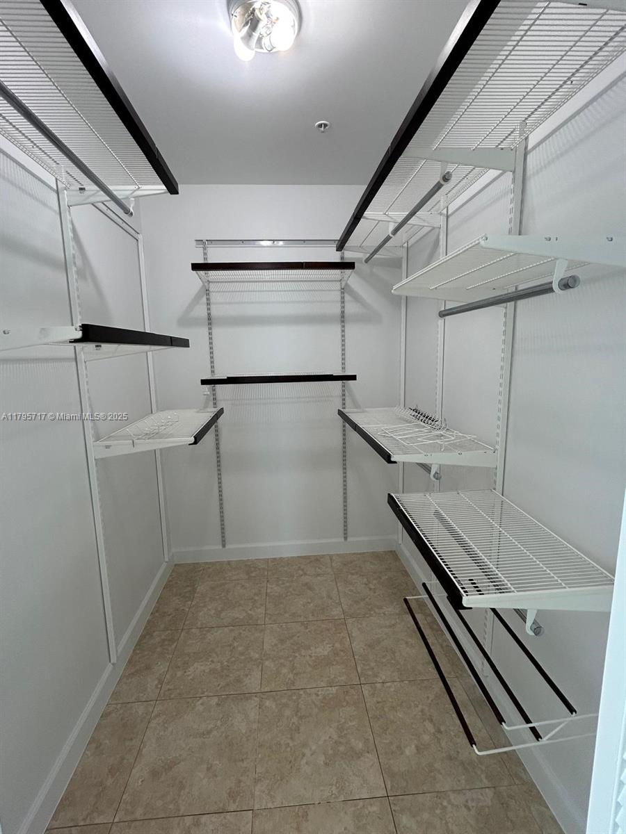 2525 Southwest 3rd Avenue, Unit 1402 Miami, FL 33129 - Photo 23 of 37 a view of a room with racks on the wall