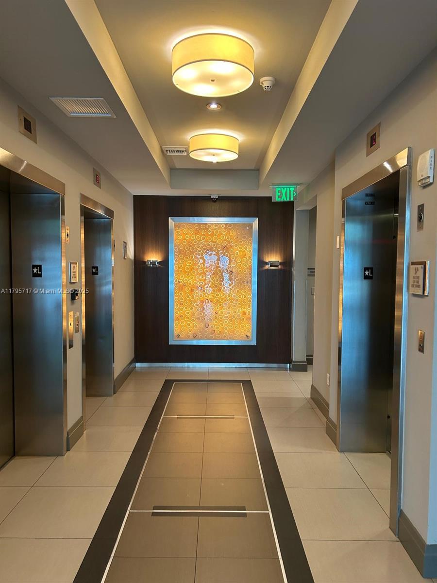 2525 Southwest 3rd Avenue, Unit 1402 Miami, FL 33129 - Photo 28 of 37 a view of an empty room with a fireplace