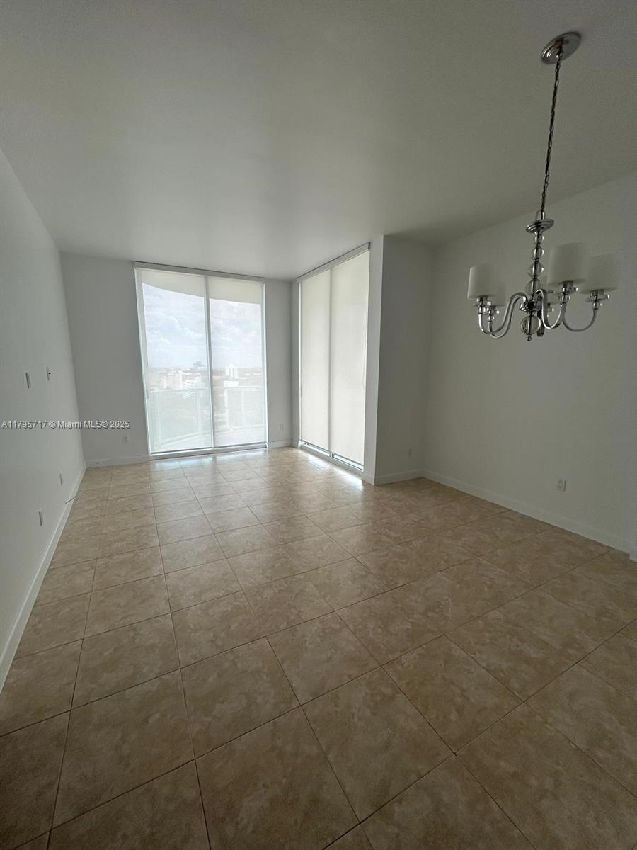 2525 Southwest 3rd Avenue, Unit 1402 Miami, FL 33129 - Photo 10 of 37 an empty room with windows