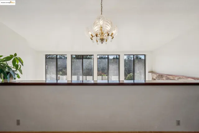 a view of a room with a large window