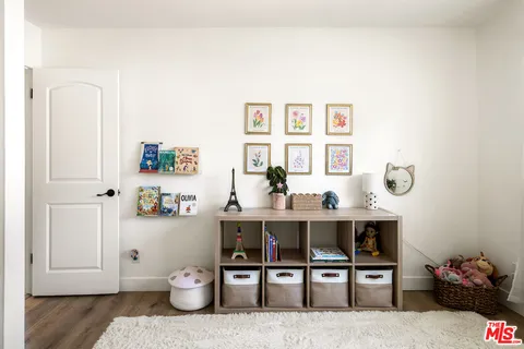 a room with cabinets and chair