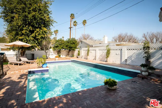 a view of a swimming pool with a patio