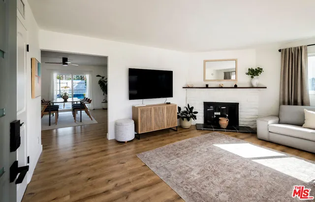 a living room with furniture and a fireplace or television
