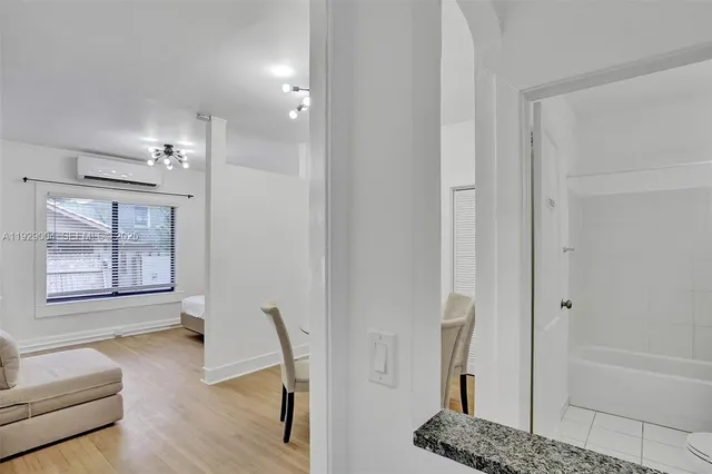 a bedroom with a large bed and a large window