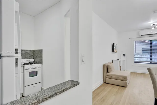 a bathroom with a tub shower and a sink