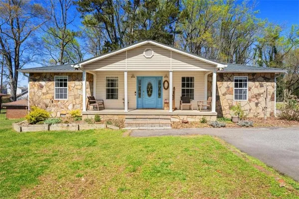 a front view of a house with a yard