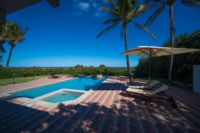 a view of swimming pool with a patio