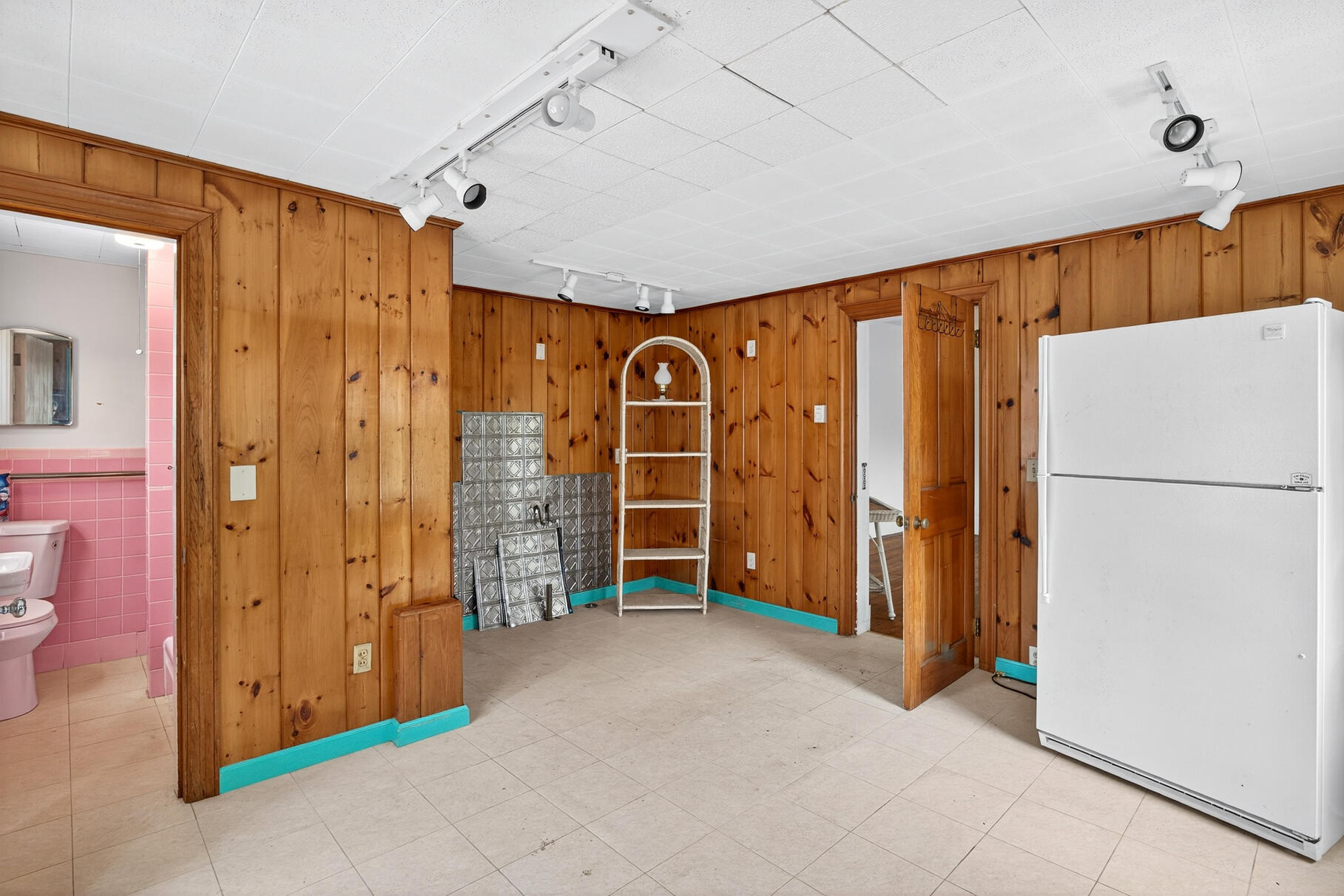 216 Main Street Orleans, MA 02653 - Photo 13 of 51 a view of a livingroom with furniture and an empty refrigerator