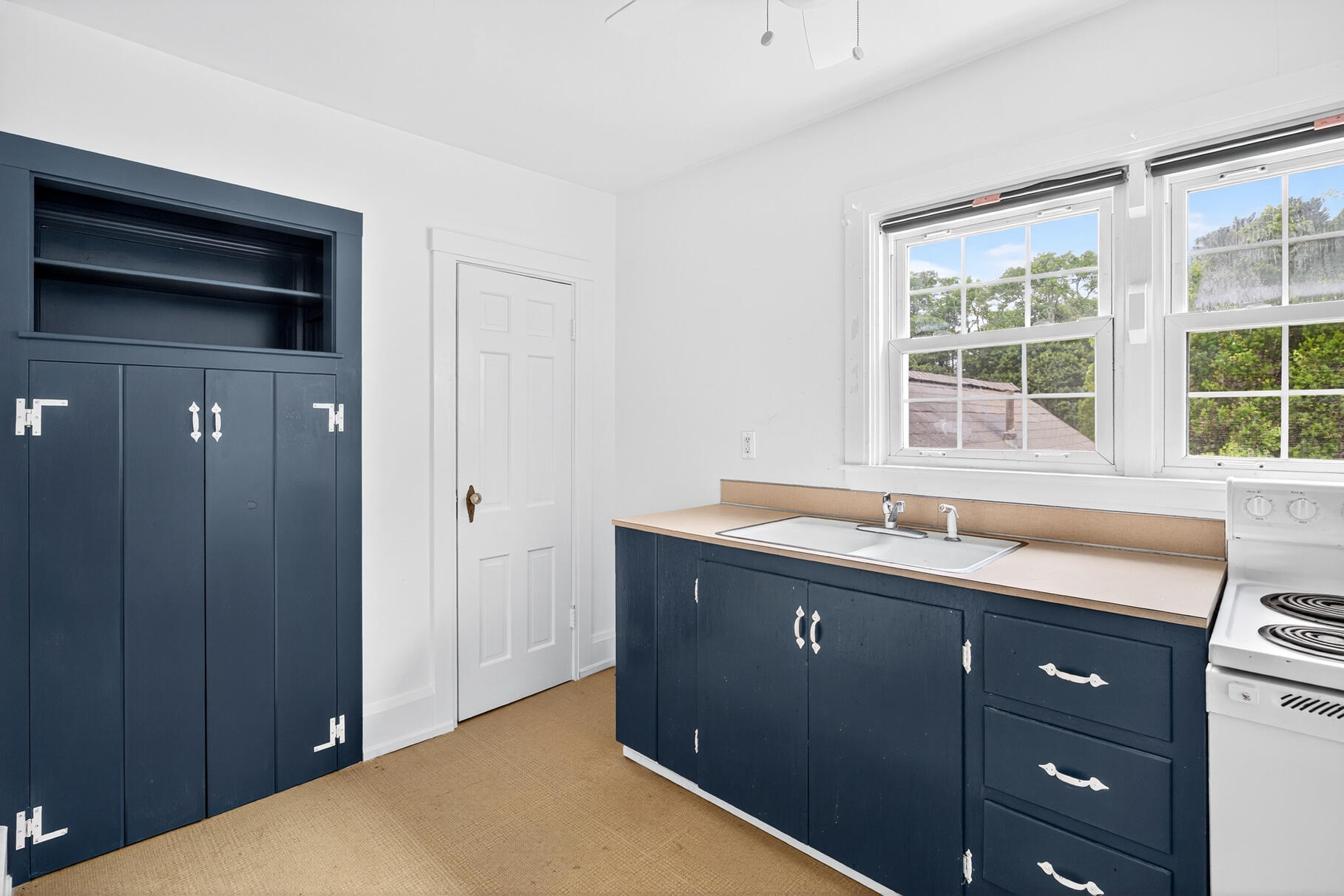216 Main Street Orleans, MA 02653 - Photo 20 of 51 a kitchen with a sink and a window