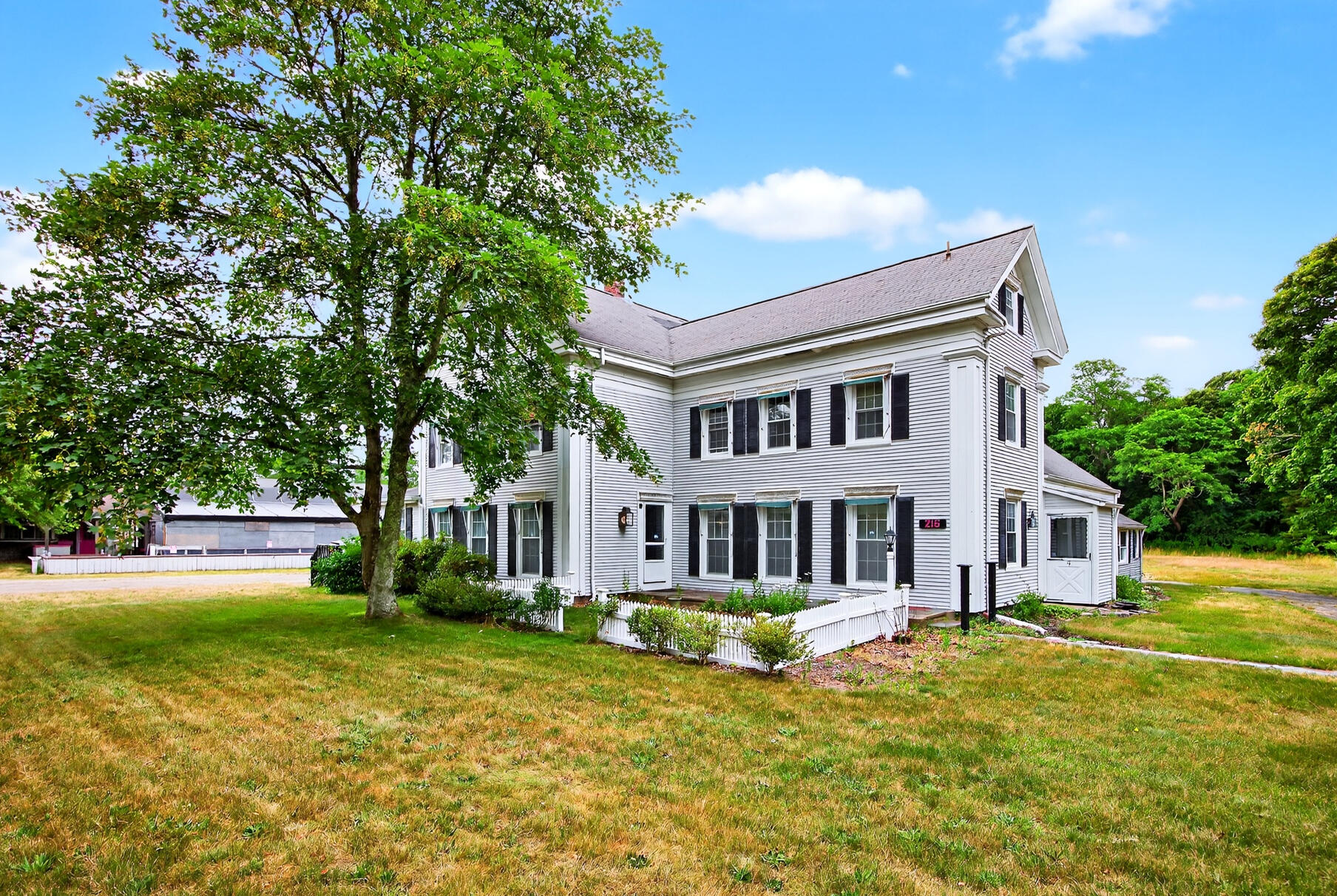 216 Main Street Orleans, MA 02653 - Photo 2 of 51 a house view with swimming pool in front of the house