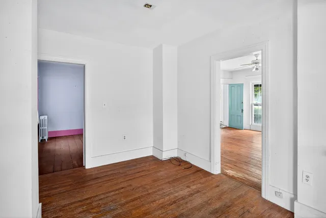 a view of entryway with wooden floor and stairs