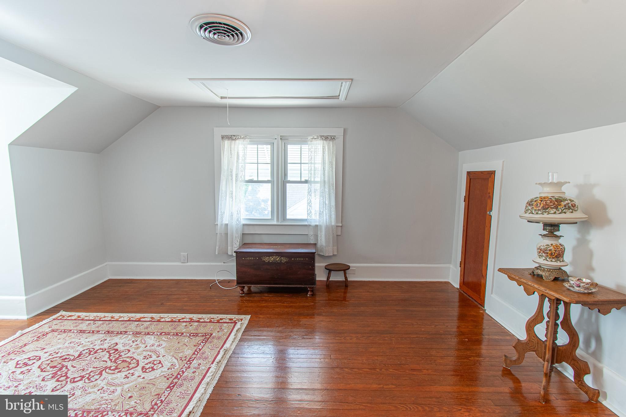 207 Crusader Road Cambridge, MD 21613 - Photo 48 of 76 an empty room with wooden floor and furniture