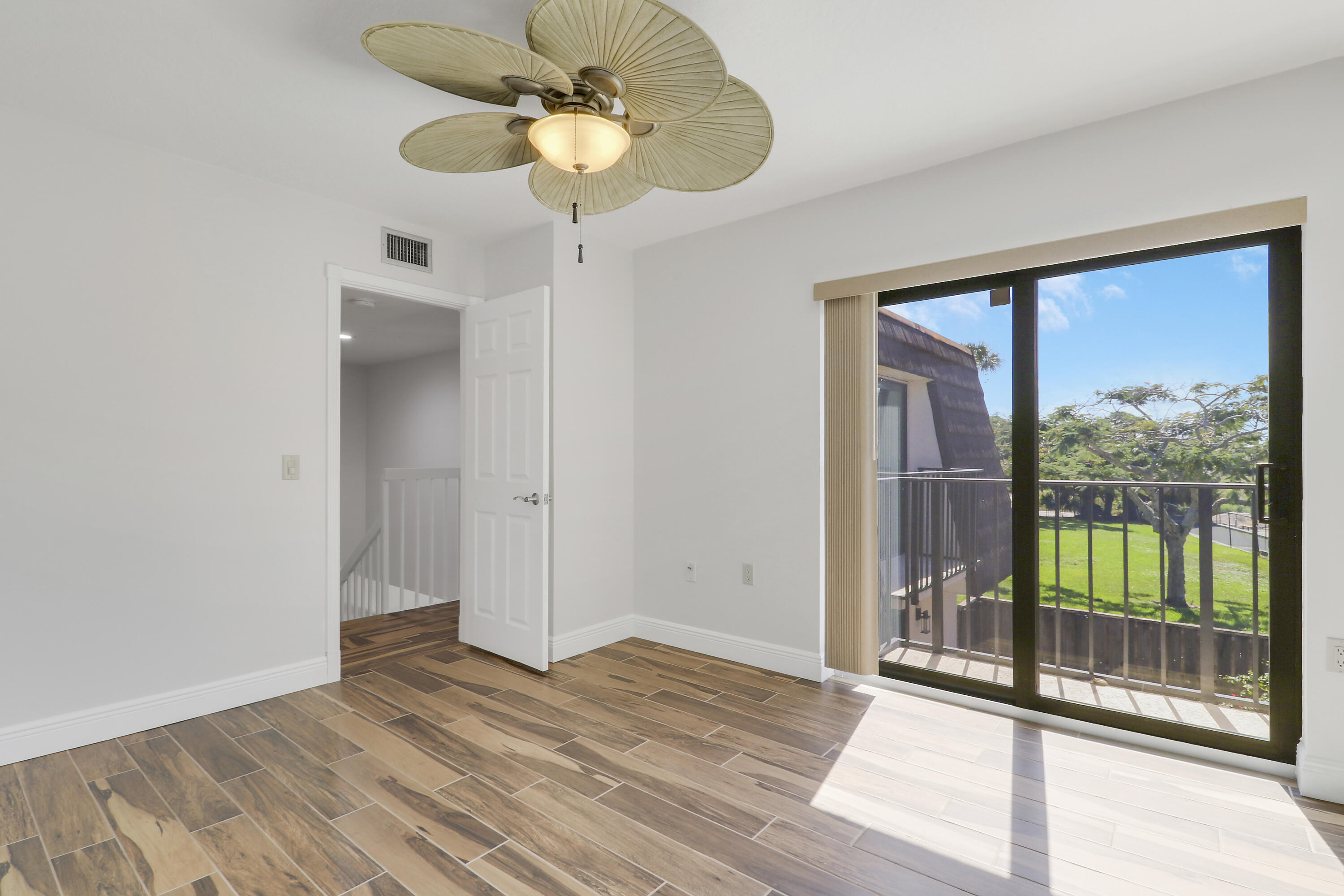 2324 23rd Court, Unit 55D Jupiter, FL 33477 - Photo 29 of 41 a view of an empty room with a window