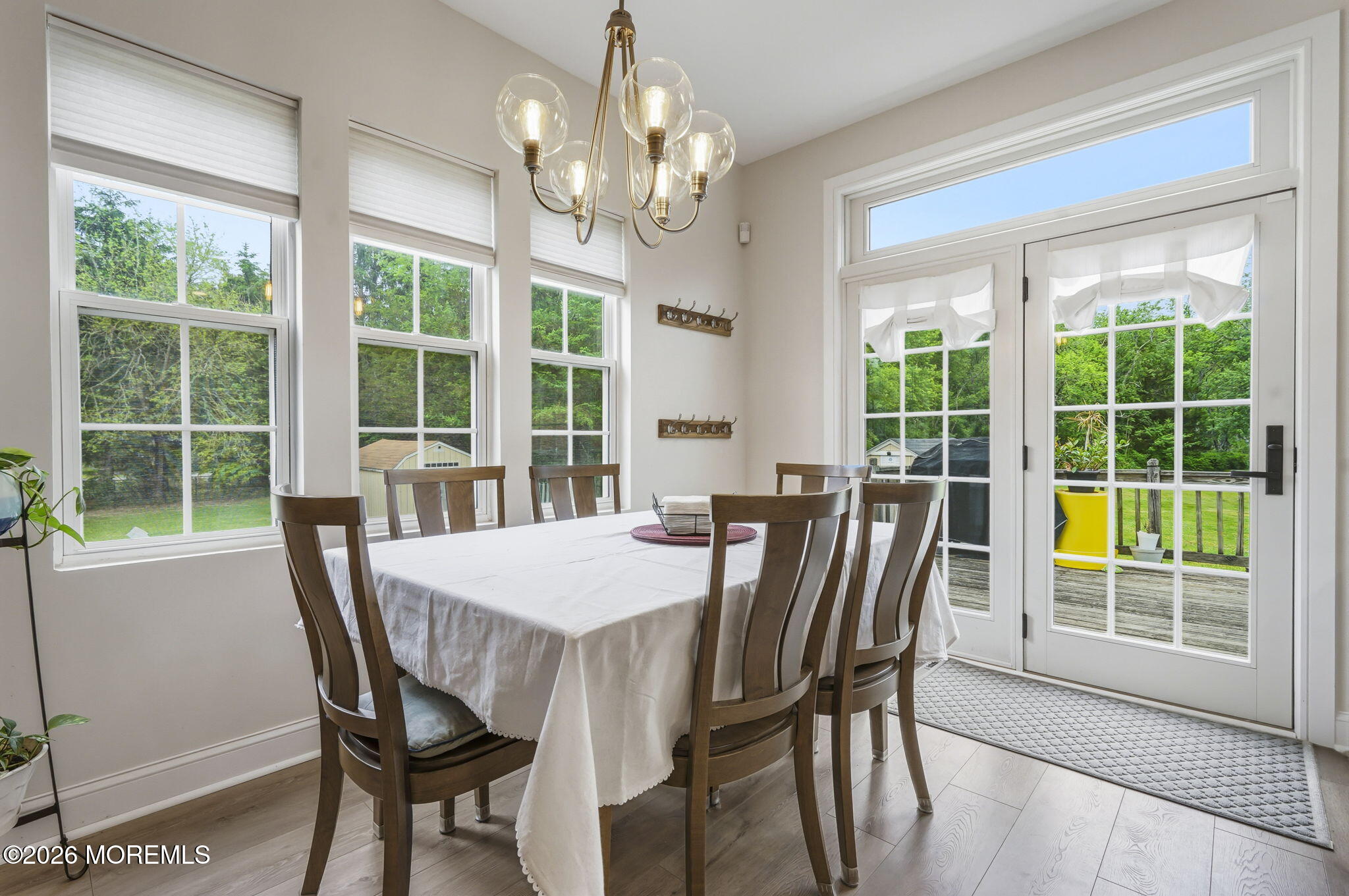 438 Bennetts Mills Road Jackson, NJ 08527 - Photo 8 of 42 a view of a dining room with furniture large windows and wooden floor