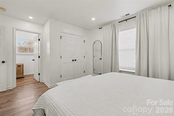 a bathroom with a shower sink and mirror