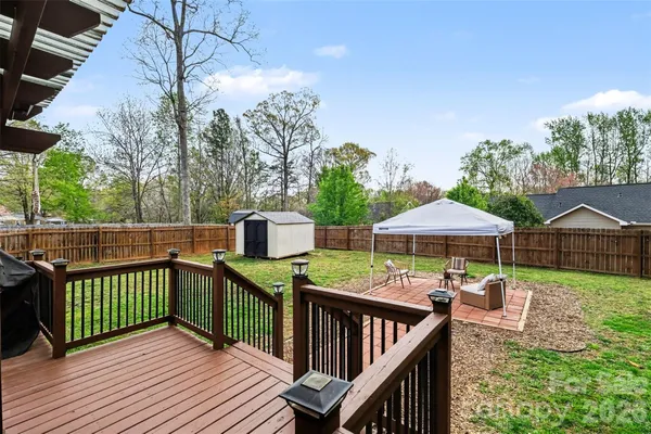 a view of a patio with wooden floor of a house