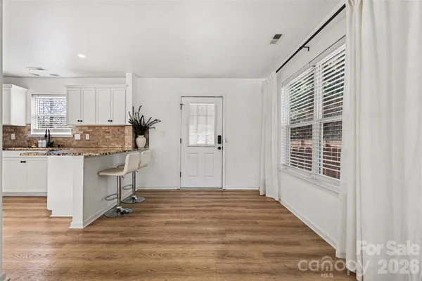 a kitchen with stainless steel appliances granite countertop a refrigerator sink and cabinets