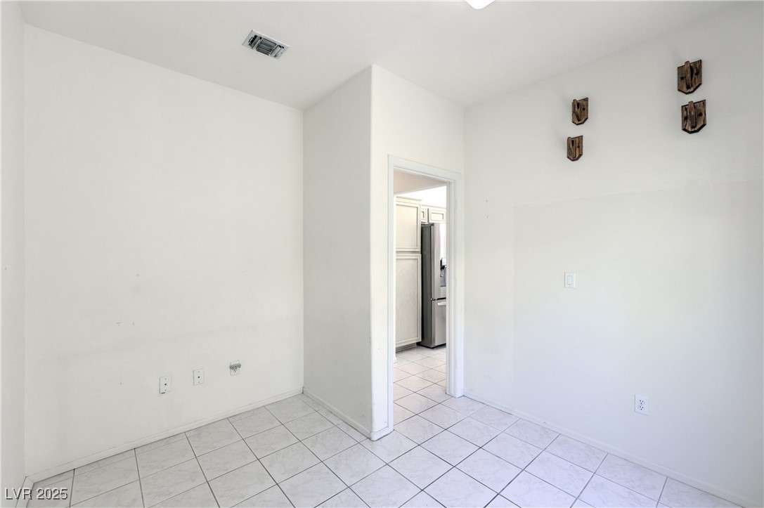 2404 Spring Water Drive Las Vegas, NV 89134 - Photo 12 of 27 Spare room with light tile patterned floors