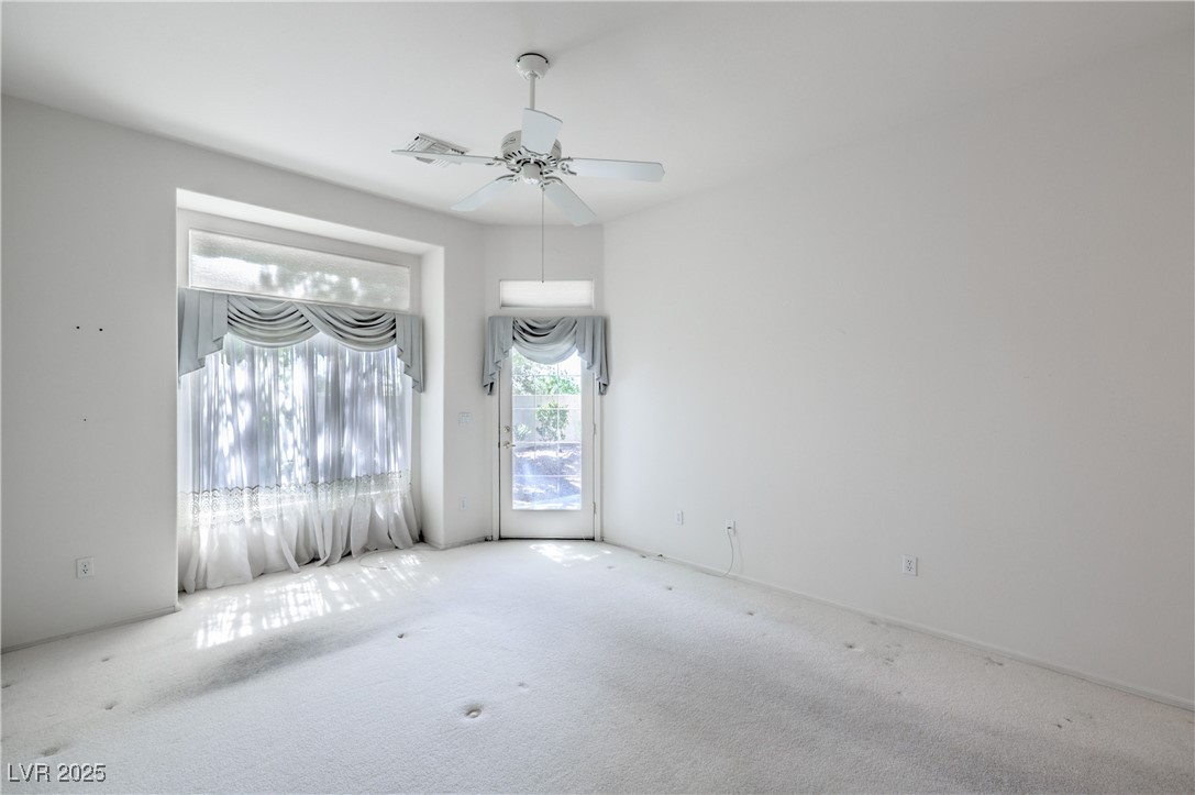 2404 Spring Water Drive Las Vegas, NV 89134 - Photo 14 of 27 Unfurnished room with carpet flooring and a ceiling fan