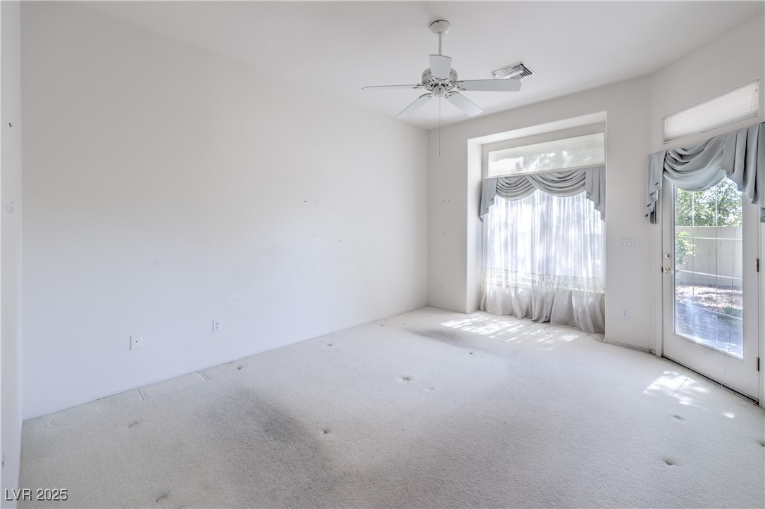 2404 Spring Water Drive Las Vegas, NV 89134 - Photo 17 of 27 Carpeted empty room featuring ceiling fan