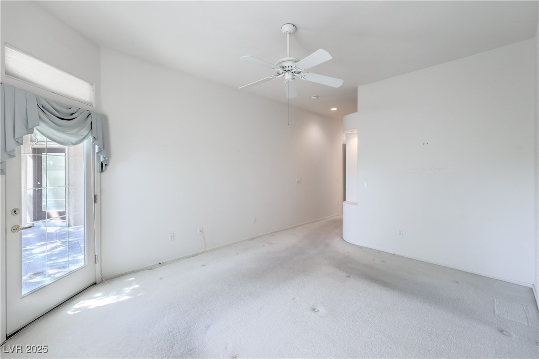 2404 Spring Water Drive Las Vegas, NV 89134 - Photo 19 of 27 Spare room with carpet floors and ceiling fan
